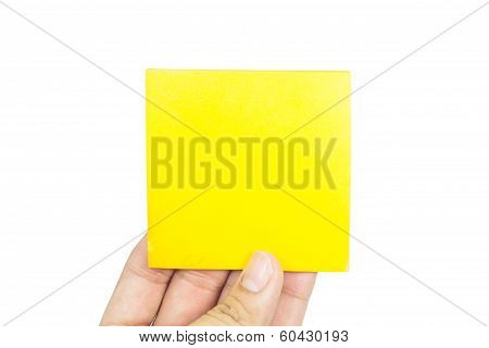 Hand holding yellow paper isolated