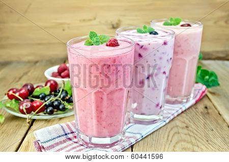 Milkshakes With Berries In Glass On Board