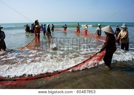 Team Work Of Fisherman On Beach