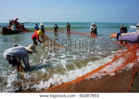 Team Work Of Fisherman On Beach