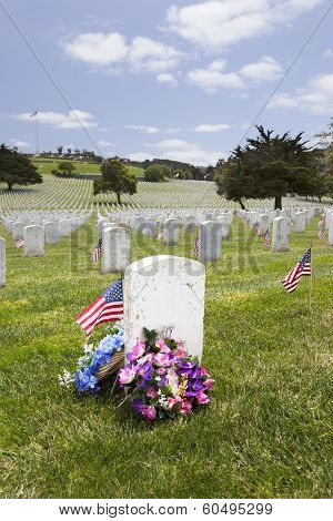 American Flag And Headstones At United States National Cemetery