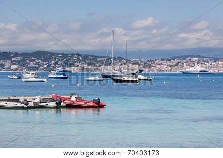 Cannes: view from Lerins Island. Small and large yachts anchored in the bay. French Riviera, Europe.