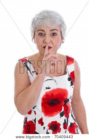Isolated Attractive Mature Woman Making Silence Or Attention Gesture With Her Finger.