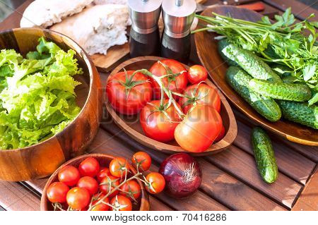 Tomatoes, Salad And Cucumbers-vegetables For Picnic. Outdoors.