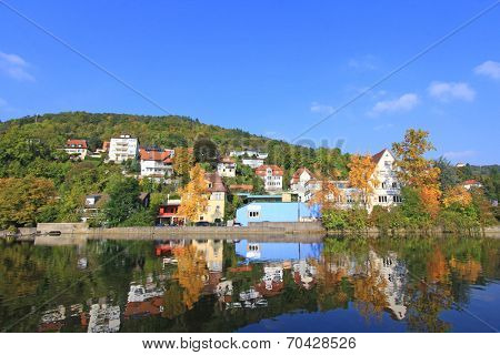 KUNZELSAU, GERMANY - OCTOBER 2013 : Colorful houses along the Kocher River during Autumn in Kunzelsau, Germany on October 8, 2013