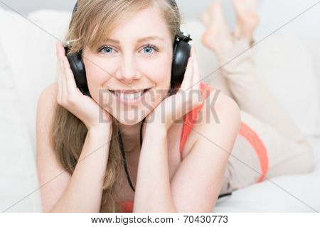 Time to relaxing, attractive young teenager girl listening to music