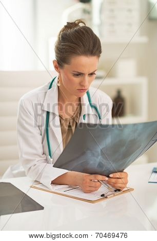 Doctor Woman Looking On Fluorography In Office