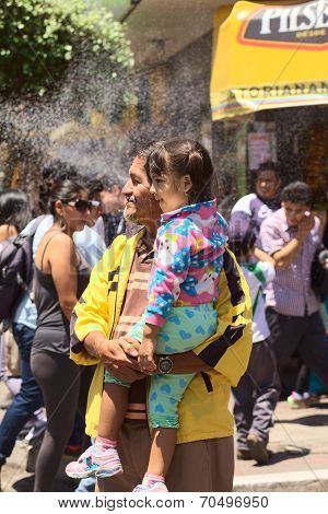 Spectators at the Carnival Parade in Banos, Ecuador