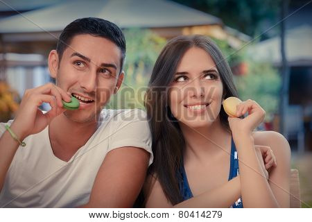 Cute Couple Having Macarons at a Restaurant