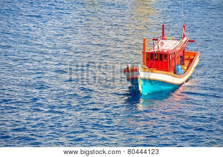 Fishing boat heading out to the gulf in the early morning