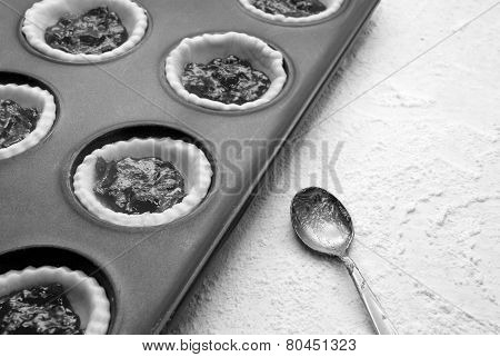 Filled, Uncooked Jam Tarts In A Tin