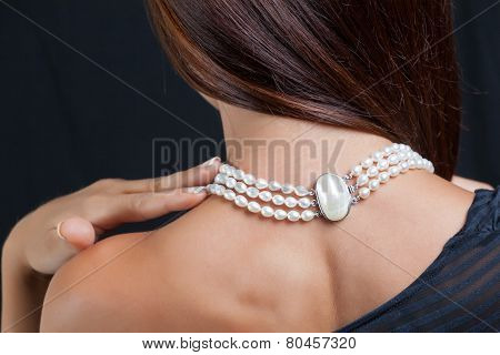 Woman With Pearl Necklace On Her Neck