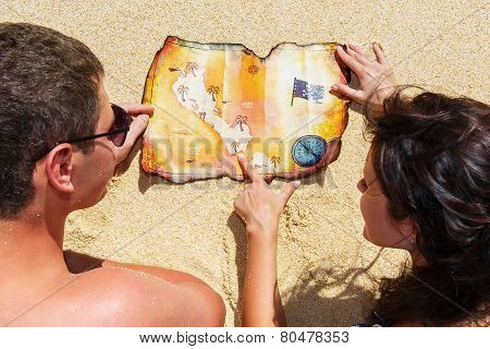 Happy Young Couple Having Fun On The Shore Of A Tropical Island. Summer Vacation Concept.