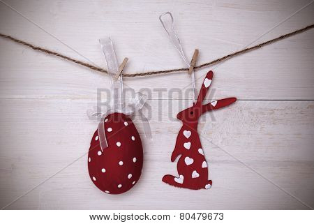 One Red Easter Bunny And Easter Egg Hanging On Line With Frame