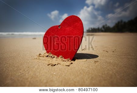 Red heart on exotic sandy beach - Valentine's day concept