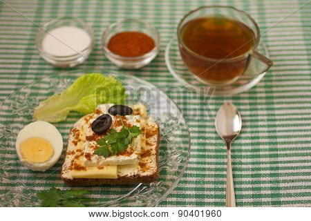 Breakfast sandwich and tea