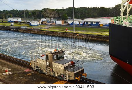 Panama Canal Locomotive Guides Ship