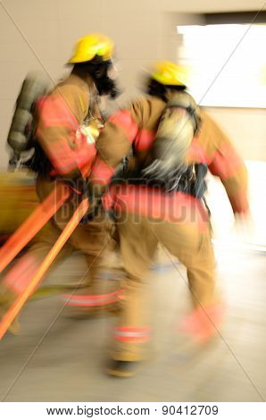 Fire fighers dragging hose