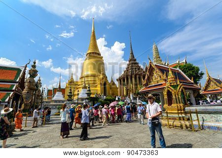 Tourists Travel To Wat Phra Kaew And Grand Palace In Bangkok, Thailand