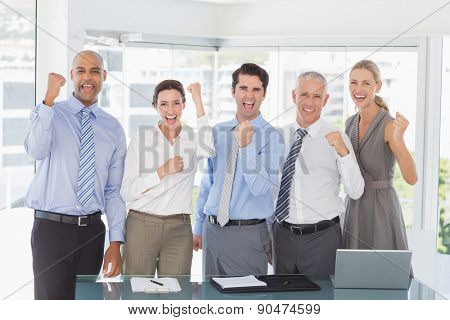 Business team celebrating a good job in the office