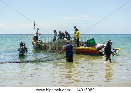 LABUAN FT, MALAYSIA - Aug 29, 2015.Fishermans on the boat with net at Pohon Batu beach, Labuan.
