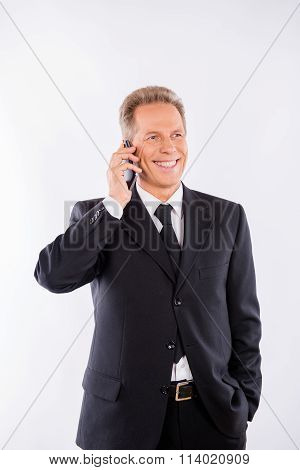 A Successful Businessman In A Formal Suit With Beaming Smile