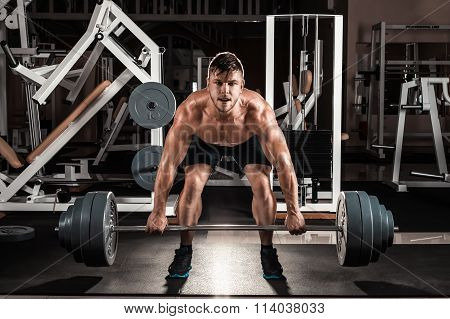 Muscular Man Doing Heavy Deadlift Exercise