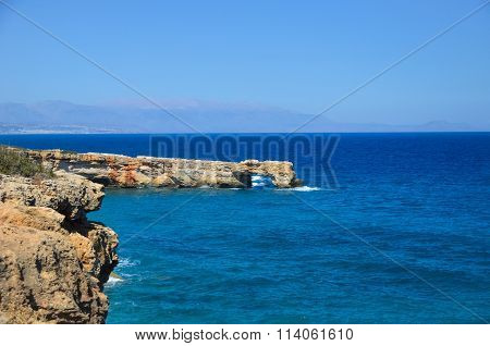 Blue Sea Meets The Rocky Shore