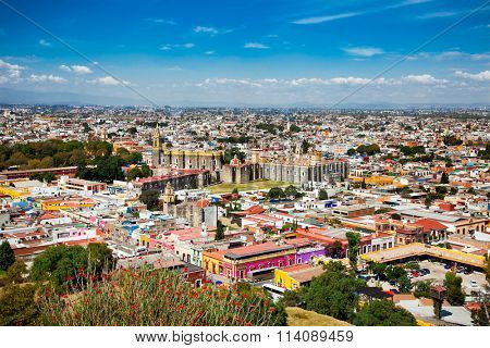 Aerial view of Convent of San Gabriel, which was built by the Spanish in Plateresque style in Cholula, Mexico. The city is famous for it's Great Pyramid - largest archaeological site of a pyramid