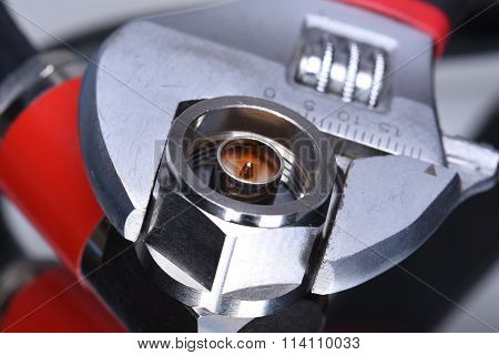 Closeup of coax connector with tool wrench