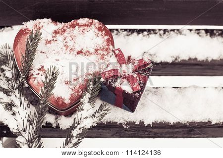 Red Heart Shaped Tin Box With A Gift Box And A Fragment Of A Pine-tree Branch