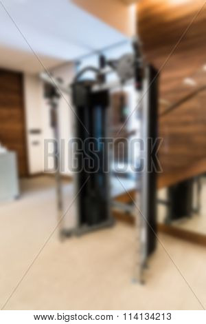 Abstract blur Fitness center with traineger equipments