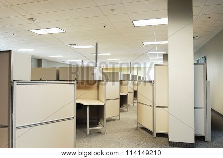 empty cubicles inside office building