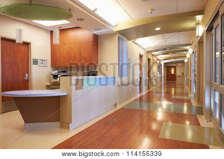 Empty Nurses Station And Corridor In Modern Hospital