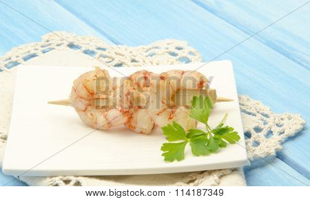 Peeled Prawns Skewer Served On A Plate