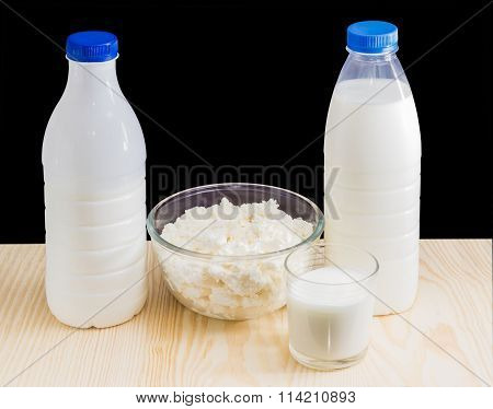 Dairy Produce On A Wooden Surface On A Dark Background