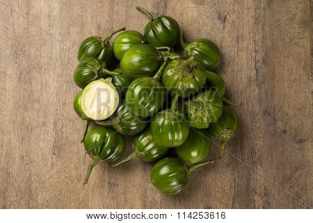 Some Green African Eggplants Over A Wooden Surface