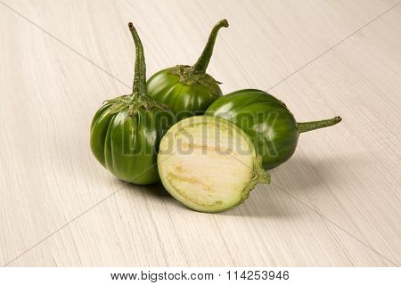 Some Green African Eggplants Over A White Background