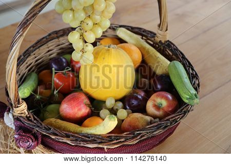Wicker Basket With Lots Of Fresh Fruit In Autumn