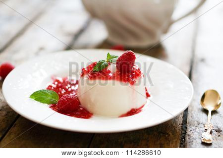 Delicious Italian Dessert Panna Cotta With Raspberry Sauce And Mint On White Background