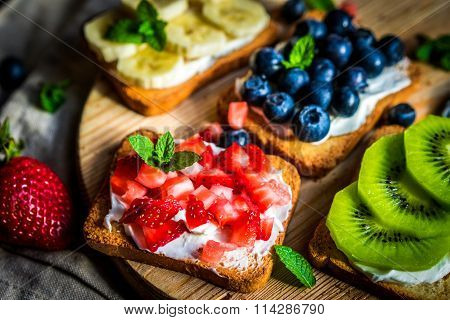Healthy Sandwiches With Fruits On Wooden Background