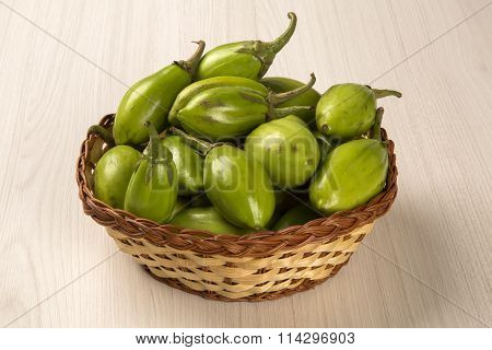 Some Green African Eggplants Over A White Background