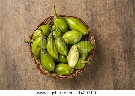 Some Green African Eggplants Over A Wooden Surface