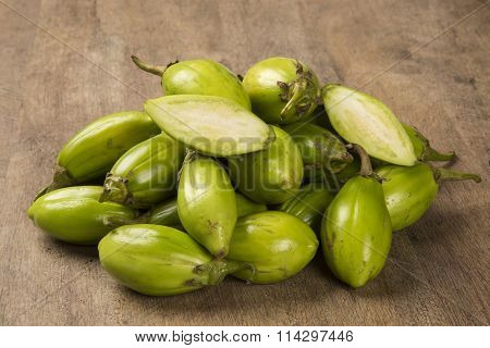 Some Green African Eggplants Over A Wooden Surface
