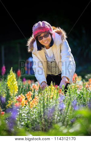 Portrait Of Happiness Asian Woman With Smiling Face In Blooming Flowers Garden Use For Relaxing Peop