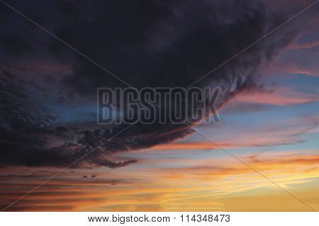 The dark clouds in the sky at sunset storm