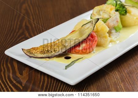 Fish with vegetables. Beautiful layout on a plate