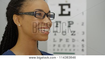 African Woman Trying On Her New Glasses