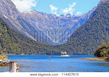 A ferry cruising in Milford sound