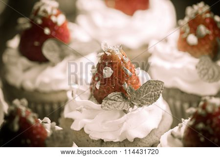 Strawberry Cupcak Topping With Pistachio And Cream Create With Filter,selective Focus,vintage Toning